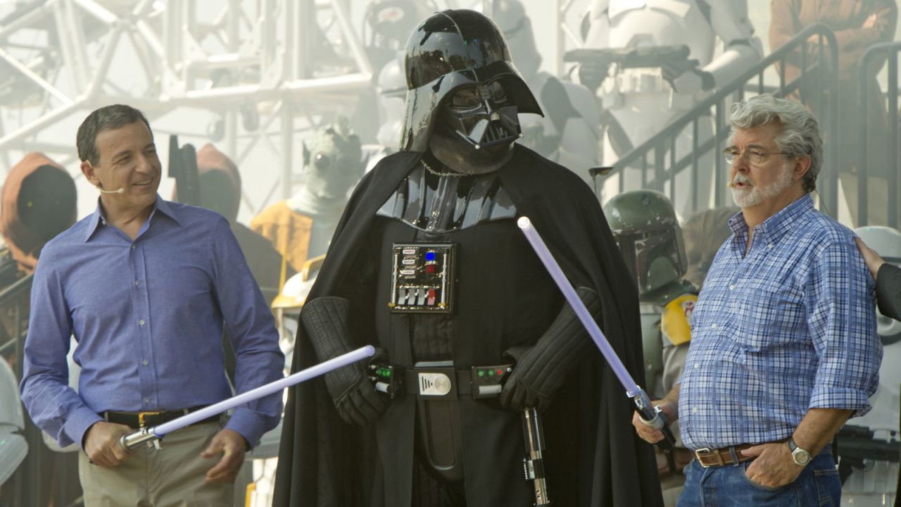 Iger (left) and George Lucas (right) pose with Darth Vader at the opening of the "Star Tours -- The Adventures Continue" attraction at Disney's Hollywood Studios in 2011.  It's now been nearly three years since Disney bought Lucasfilm for $4 billion. 
