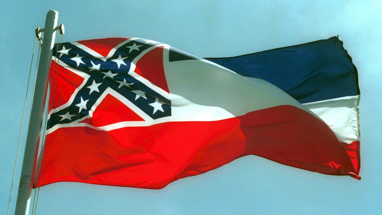 387975 02:  The Mississippi State flags flies April 17, 2001 in Pascagoula, MS. Voters will decide whether to replace the state's old flag, which sports the Confederate battle cross, with a new flag that would have 20 white stars on a blue square.  (Photo by Bill Colgin/Getty Images) 