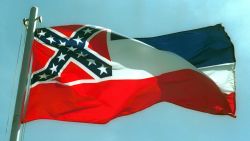 387975 02:  The Mississippi State flags flies April 17, 2001 in Pascagoula, MS. Voters will decide whether to replace the state's old flag, which sports the Confederate battle cross, with a new flag that would have 20 white stars on a blue square.  (Photo by Bill Colgin/Getty Images)