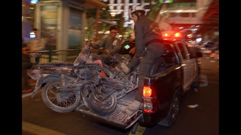 Authorities transport motorcycles destroyed in the blast.
