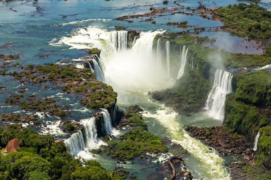 A staggering spectacle of 275 waterfalls that cascade over more than a mile of the border between Brazil and Argentina, Iguazu's name translates as "Big Water" -- a "huge understatement" says LP.