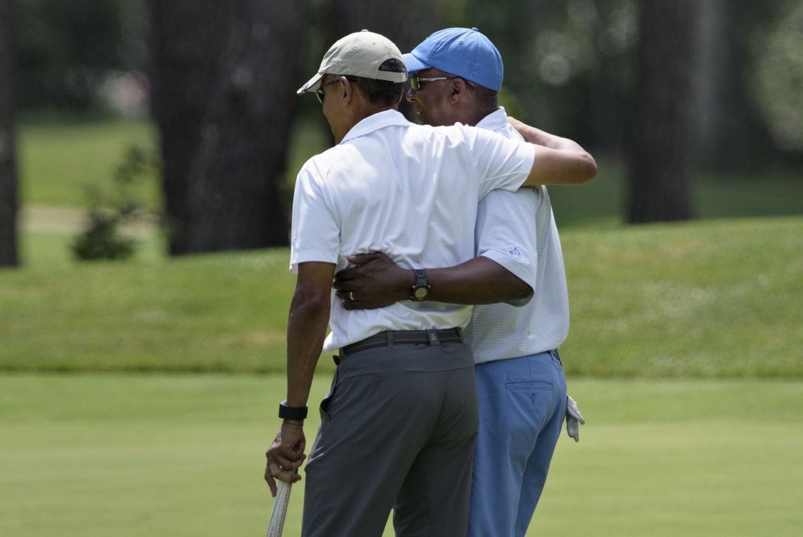 Obama and Kirk embrace during their golf outing.