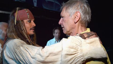 Is this a bromance in the making? When Captain Jack Sparrow meets Han Solo, it certainly is, at least in our dreams. Johnny Depp (in full Captain Jack regalia) came face to face with Harrison Ford on Saturday, August 15 at Disney's D23 Expo (promoting the next "Pirates of the Caribbean" and the next "Star Wars," respectively), and the photo quickly went viral. If only we were a fly on the wall ...