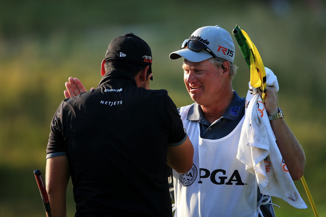 The tearful 27-year-old was congratulated by his longtime caddy and mentor Colin Swatton on the 18th green.