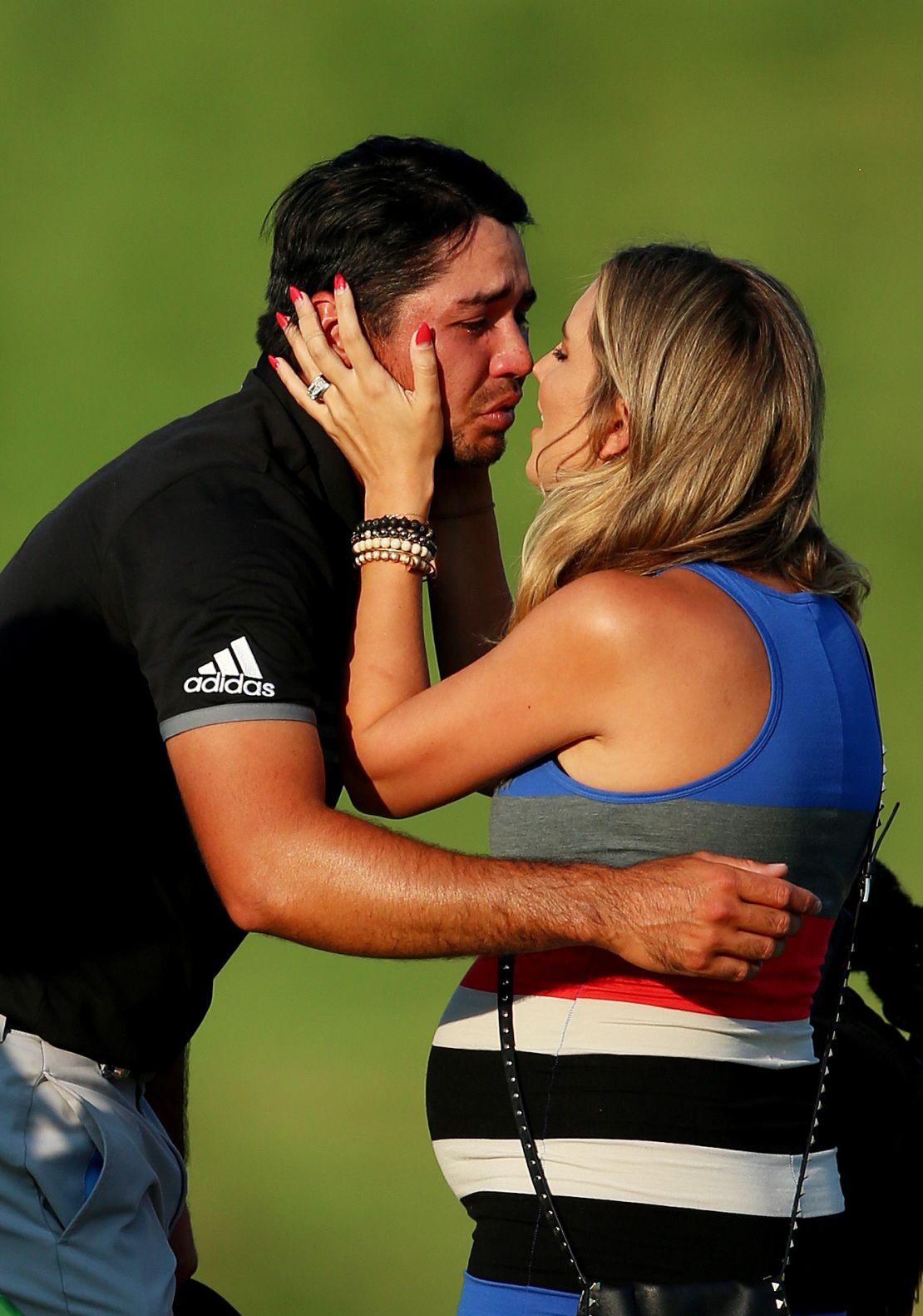A tearful Jason Day celebrates with his wife Ellie after winning the 2015 PGA Championship.