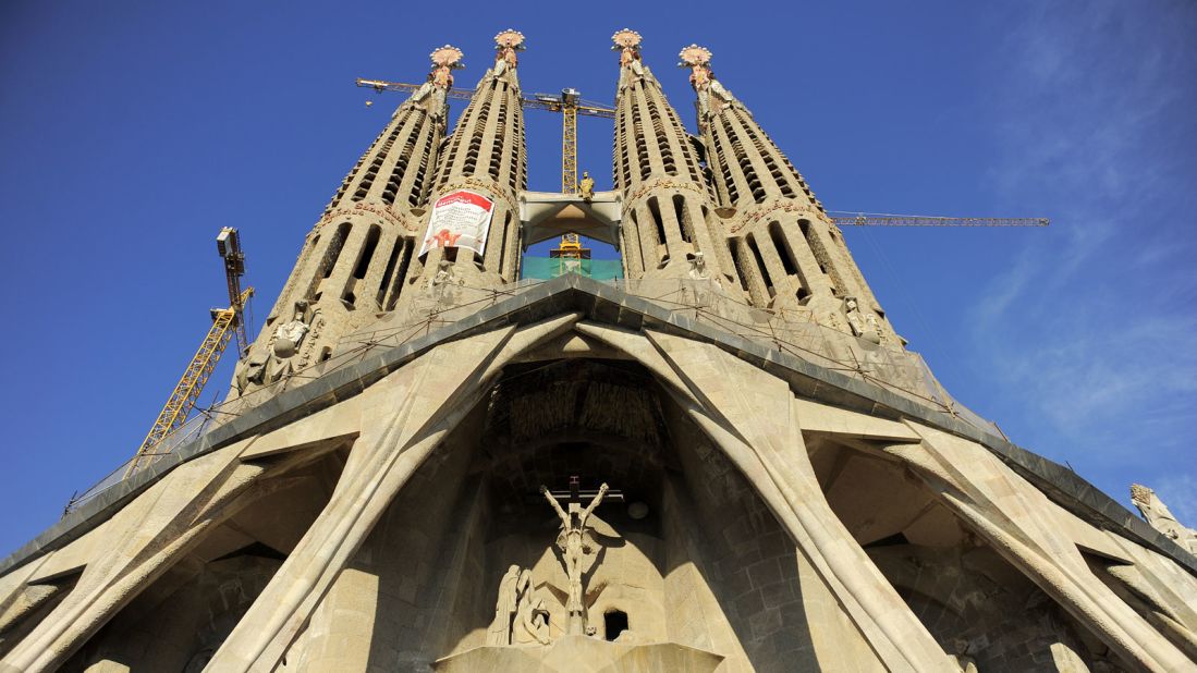 La Sagrada Familia in Barcelona, Spain lifts the eyes upon arrival with its grand structure.
