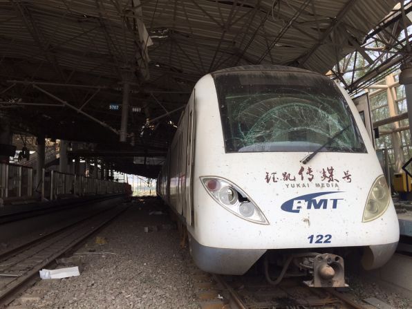 A train with a smashed-up windscreen sits abandoned in the eerily deserted station on August 17.