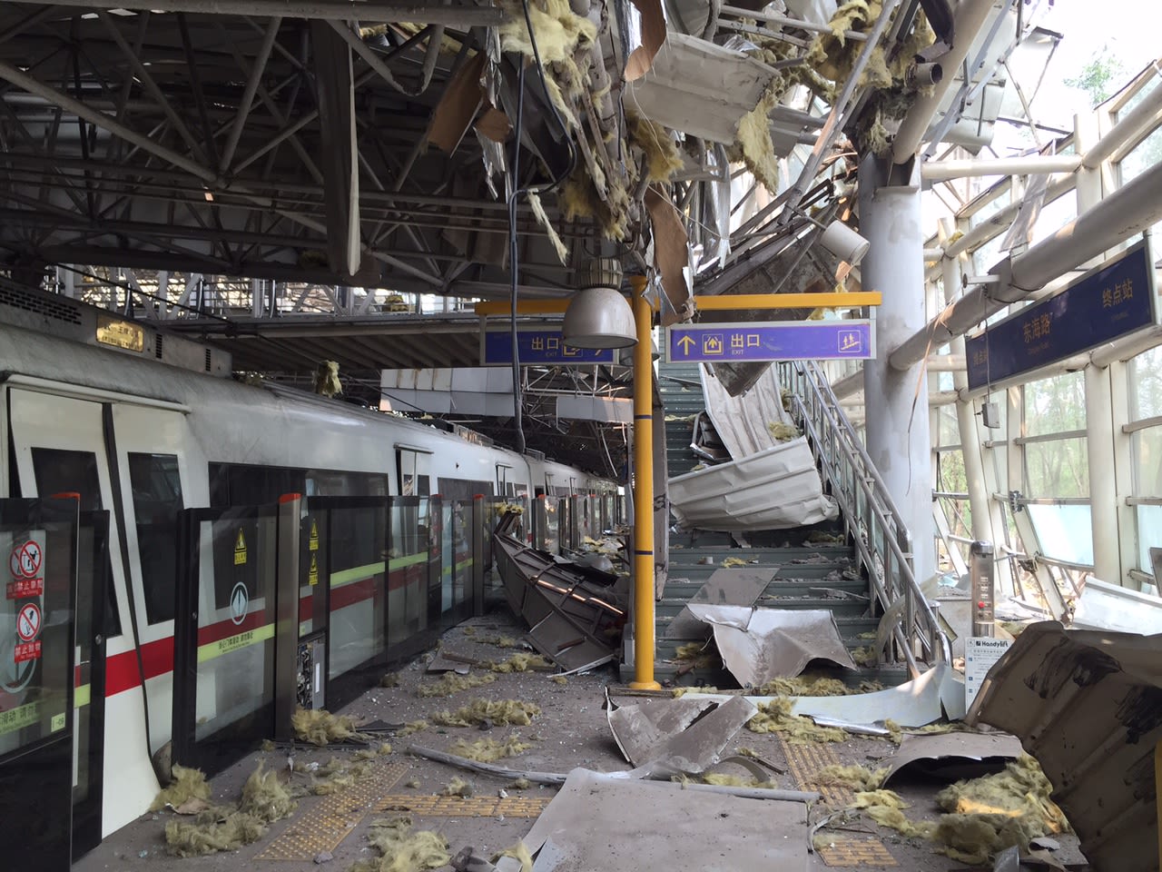 The Donghai Road light rail terminal station in Tianjin, China, is seen covered in debris on Monday, August 17.  Explosions at a chemical warehouse left more than a hundred people dead and hundreds injured. Fire officials say hazardous chemicals stored at the warehouse were ignited by fire, but the fire's cause is still being investigated.