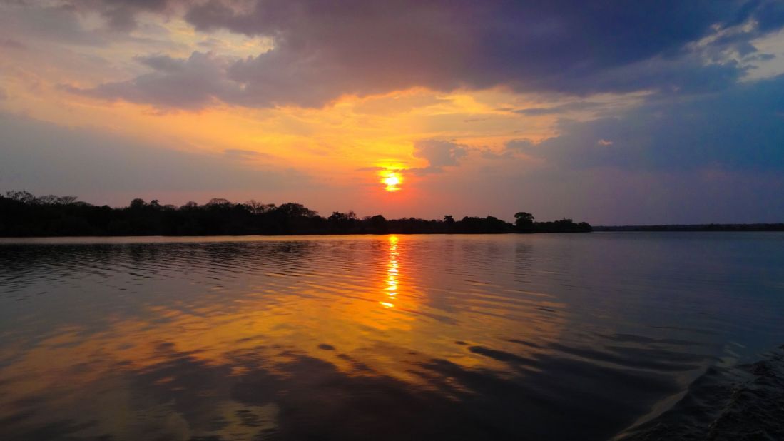 The legendary African sunsets look even better when they're reflected in the deep waters of the Zambezi. 