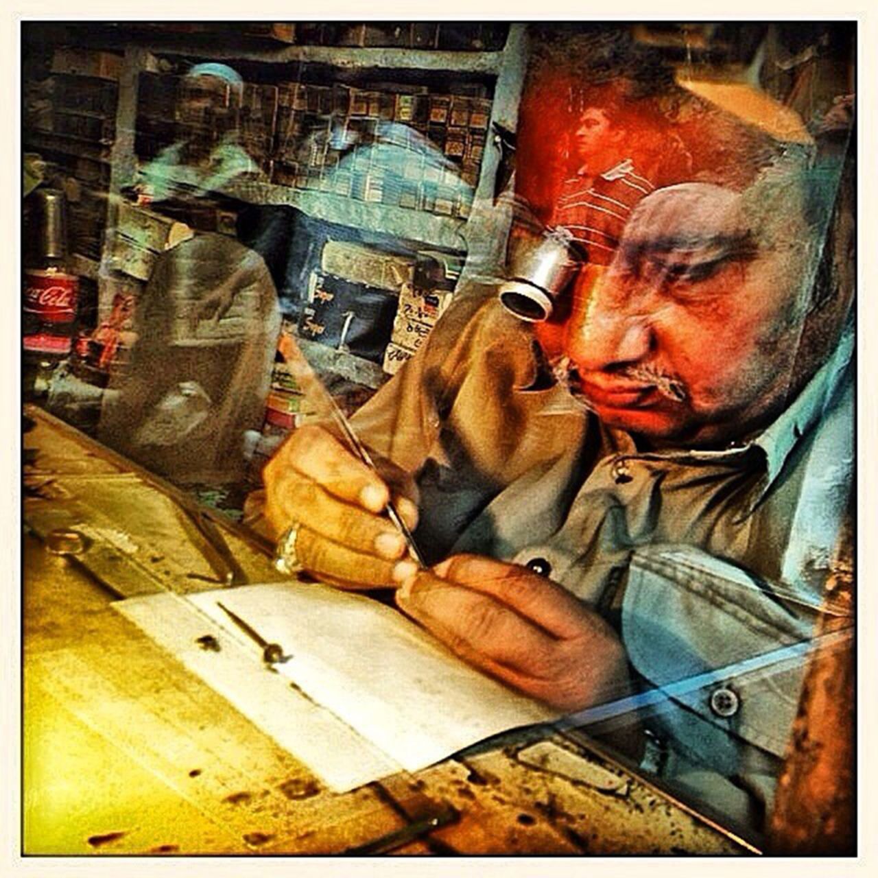 An Indian <a href="https://instagram.com/p/gp-kghhNta/" target="_blank" target="_blank">watchmaker</a> uses an eye glass to fix up a wrist watch in the old quarters of #Delhi