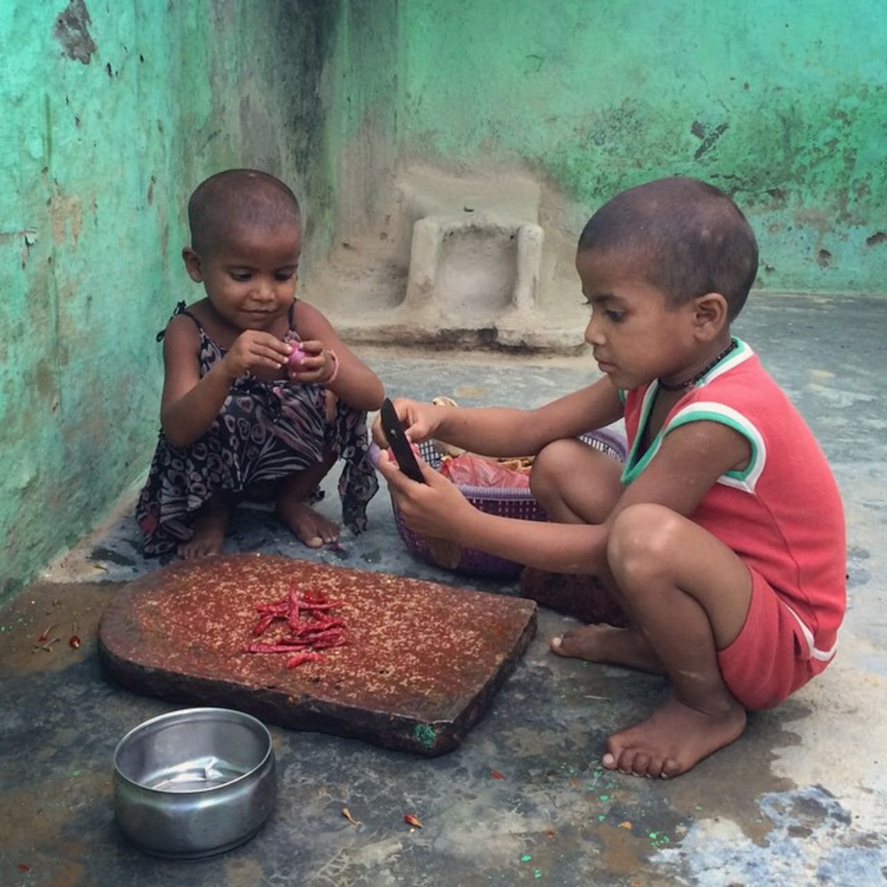 Young siblings try to make <a href="https://instagram.com/p/4a04rIn5wg/" target="_blank" target="_blank">chutney</a> for lunch at their home in Meerut, India. 