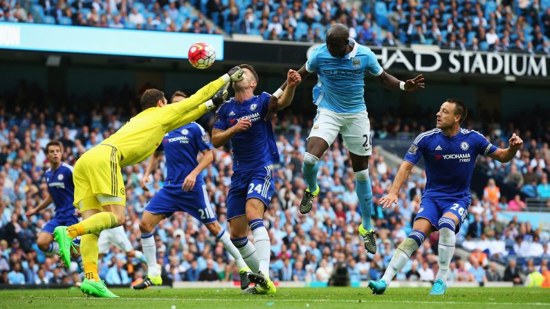 Chelsea goalkeeper Asmir Begovic tries to punch away the ball, but he connects with the face of teammate Gary Cahill instead during a Premier League match in Manchester, England, on Sunday, August 16. Chelsea, last season's Premier League champions, lost the match 3-0 to Manchester City.