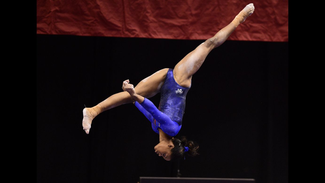 Gabby Douglas, an American gymnast who won Olympic gold in the 2012 all-around, competes on the balance beam during the P&G Gymnastics Championships on Thursday, August 13. The national competition was held in Indianapolis.