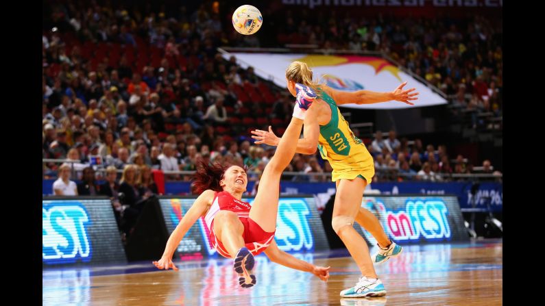 England's Jade Clarke falls after colliding with Australia's Laura Geitz during a Netball World Cup match in Sydney on Tuesday, August 11. Australia would go on to win the tournament, its 11th title. England finished in third place.