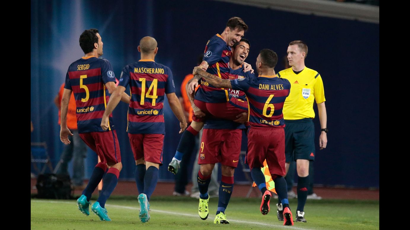 Barcelona's Lionel Messi celebrates on the arms of Luis Suarez after a goal in the UEFA Super Cup on Wednesday, August 12. Barcelona, the winners of the Champions League, defeated Sevilla, the winners of the Europa League, 5-4 in Tbilisi, Georgia.