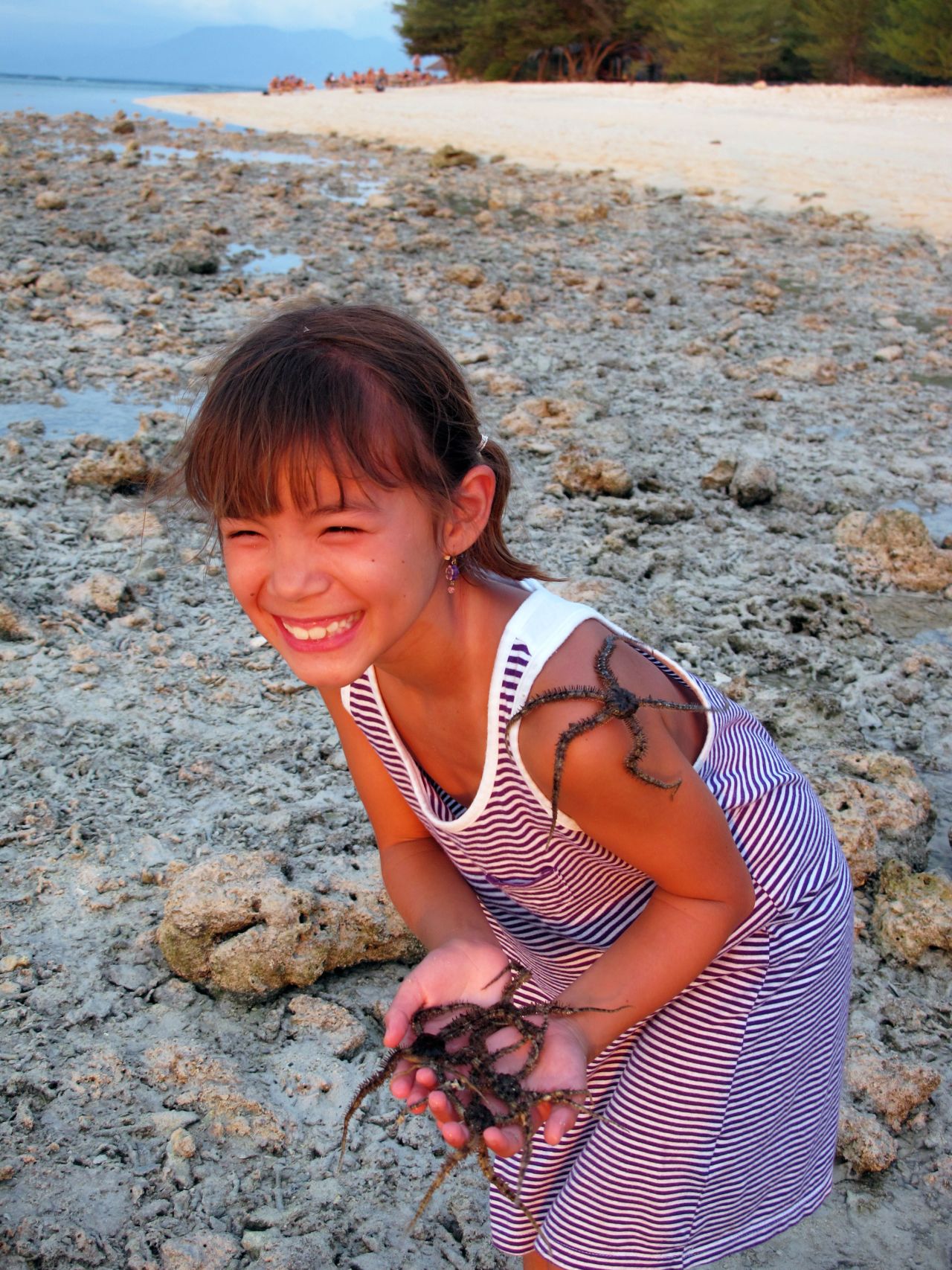 "The starfish were literally everywhere on the beach hiding underneath the rocks and corrals that were exposed at low tide," says <a href="http://ireport.cnn.com/docs/DOC-1038853">Joyce Wilmot</a>, who captured this photo of her daughter.