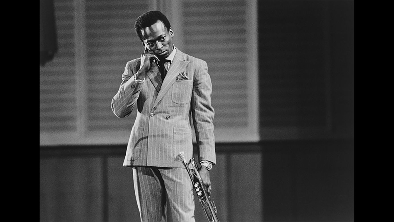 Miles Davis holds his trumpet on stage during a performance in West Germany in 1959. That year, Davis released one of his most lauded albums, "Kind of Blue." He recorded the tracks with an all-star group of musicians, including pianist Bill Evans, saxophonists John Coltrane and Julian "Cannonball" Adderley, drummer Jimmy Cobb and bassist Paul Chambers.