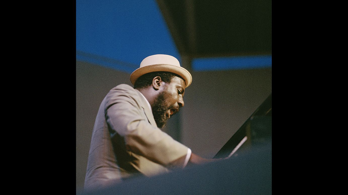 This shot, titled "Monk in Blue Hue," shows pianist Thelonious Monk circa 1960. A clothing enthusiast, Monk was known for his hats and fashion choices as well as his virtuoso musical performances.