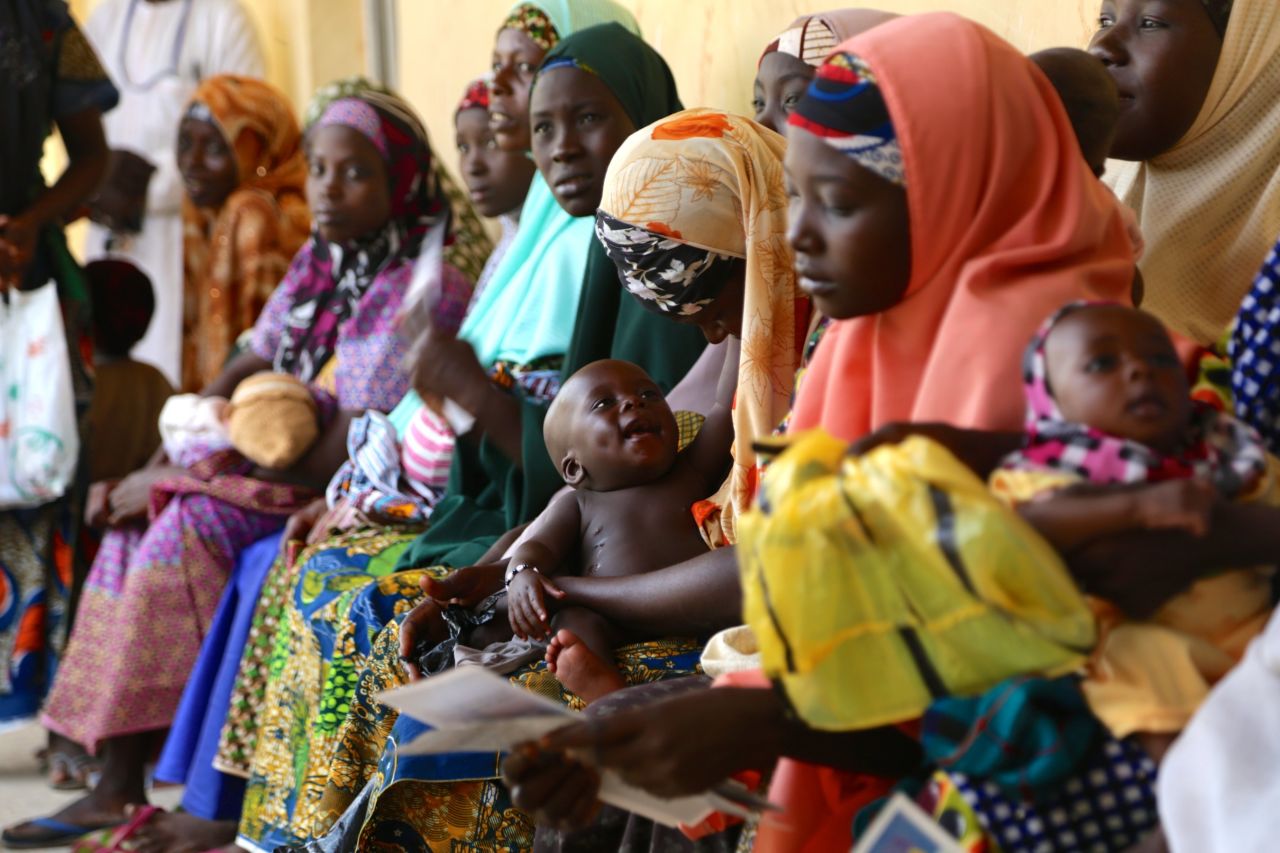 A huge immunization drive in Nigeria has meant there have been no new cases of polio for more than a year. Immunization cards in hand, mothers wait patiently with their babies at a government clinic in Sumaila District, Kano State. Long lines are now the norm, which is a positive sign.