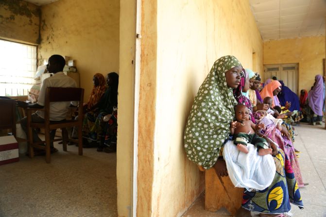 Healthcare workers administer the oral polio vaccine along with routine immunizations at a clinic in Sumaila District. Polio vaccine coverage in the district is an impressive 85%.