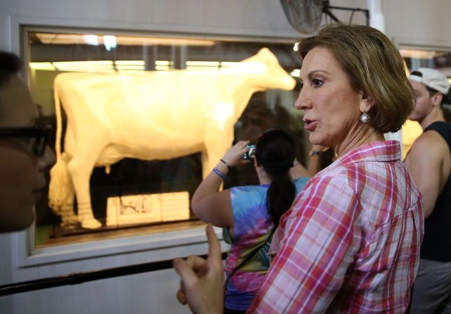 Fiorina looks at the fair's butter cow on August 17.