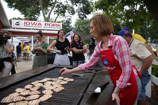 Republican presidential candidate Carly Fiorina works the grill at the Iowa Pork Producers tent on August 17.