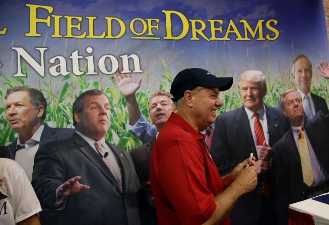 Graham visits the booth of Iowa's Republican Party on August 17.