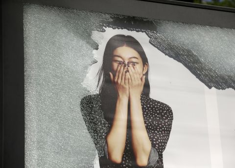 Glass covering an advertising billboard is shattered. 
