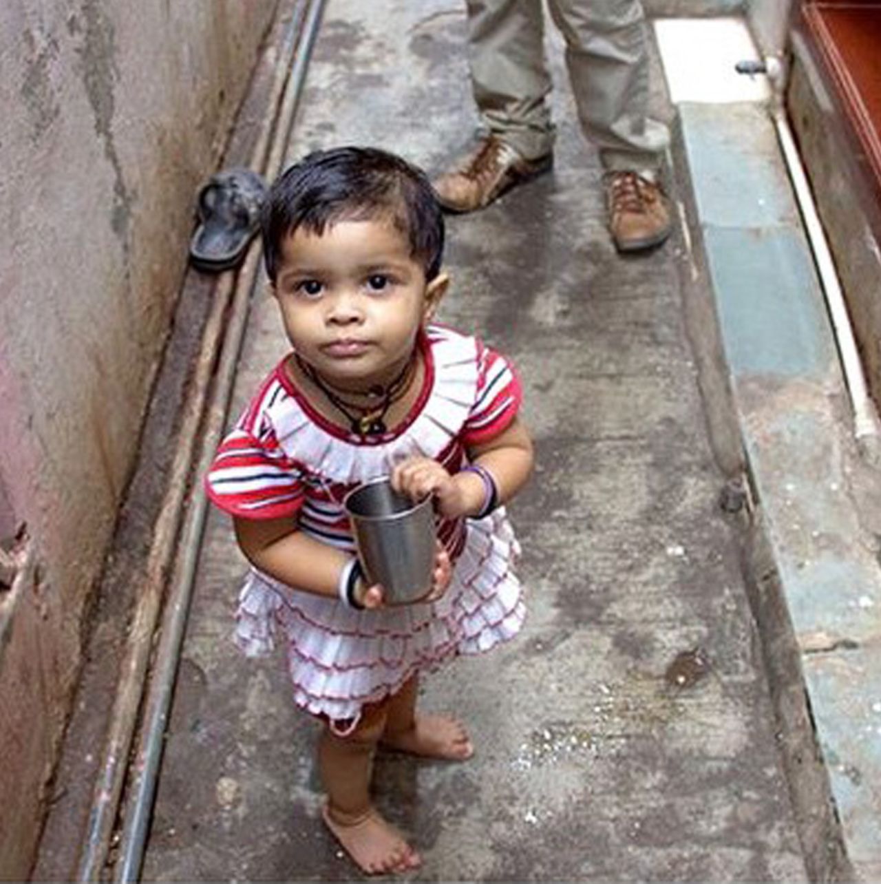 "This was probably one of the most heart warming <a href="https://instagram.com/officialhumansofbombay/" target="_blank" target="_blank">moments</a> from our shoot at Dharavi (Mumbai's largest slum). Amidst the heat and lack of resources, this little girl looked up at me, smiled and said, "Didi, pani?" ("Water, sister?"). I guess it's because she's from one of the most hospitable places I've been to in the city. It was so overwhelming to have this little girl offer me water from her own glass, purely out of kindness."