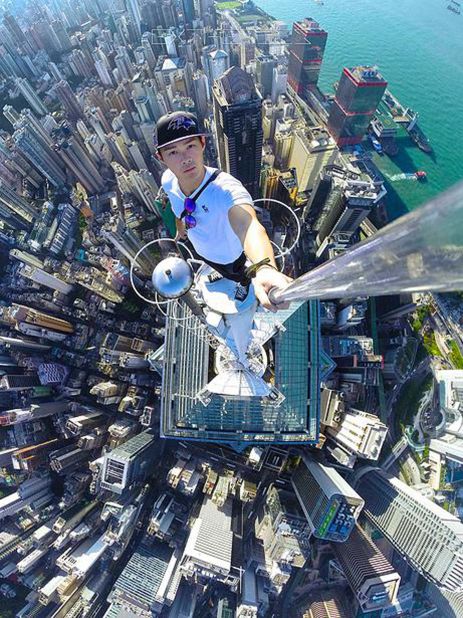 In this picture, Lau stands atop what looks like Hong Kong's skyscraper The Center. This is also the same building where he shot a video with two other climbers eating banana that went viral last year.