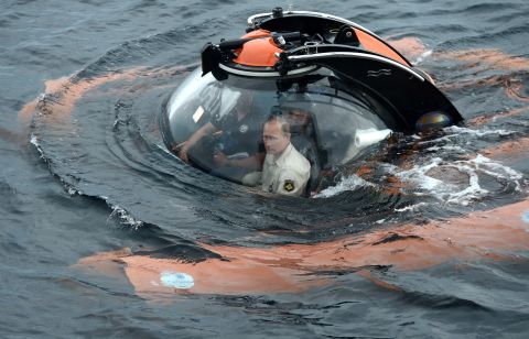 Putin sits in a bathyscaphe as it plunges into the Black Sea along the coast of Sevastopol, Crimea, on Tuesday, August 18. Putin went underwater to see the wreckage of an ancient merchant ship that was found in the end of May. 