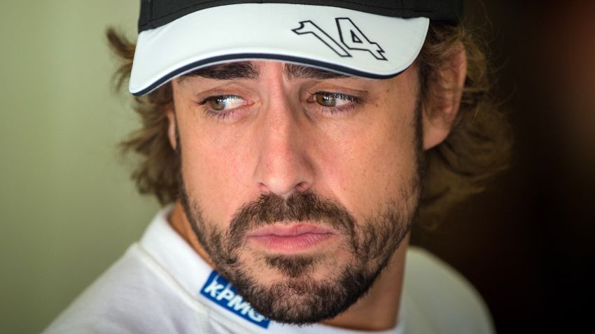 McLaren Honda's Spanish driver Fernando Alonso waits in the pits during the third practice session at the Hungaroring circuit  near Budapest on July 25, 2015, on the eve of the  Hungarian Formula One Grand Prix. AFP PHOTO / ANDREJ ISAKOVIC        (Photo credit should read ANDREJ ISAKOVIC/AFP/Getty Images)