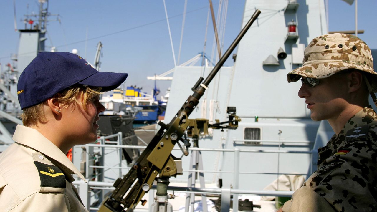 A female member of the Danish navy talks with a German soldier at a port in Cyprus in 2006.