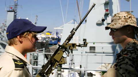 A female member of the Danish navy talks with a German soldier at a port in Cyprus in 2006.