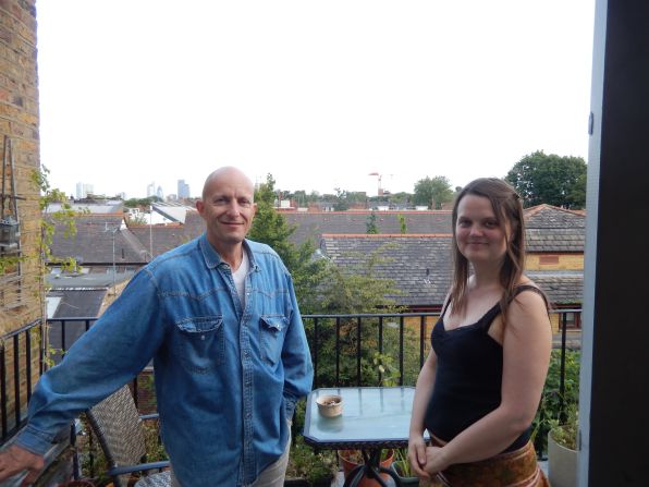 Peter Keserue and Karen Grace on the commune balcony. There is a maximum income for new housemates and diversity criteria. Places are always in demand due to the difficulty to make London's high rents for many.