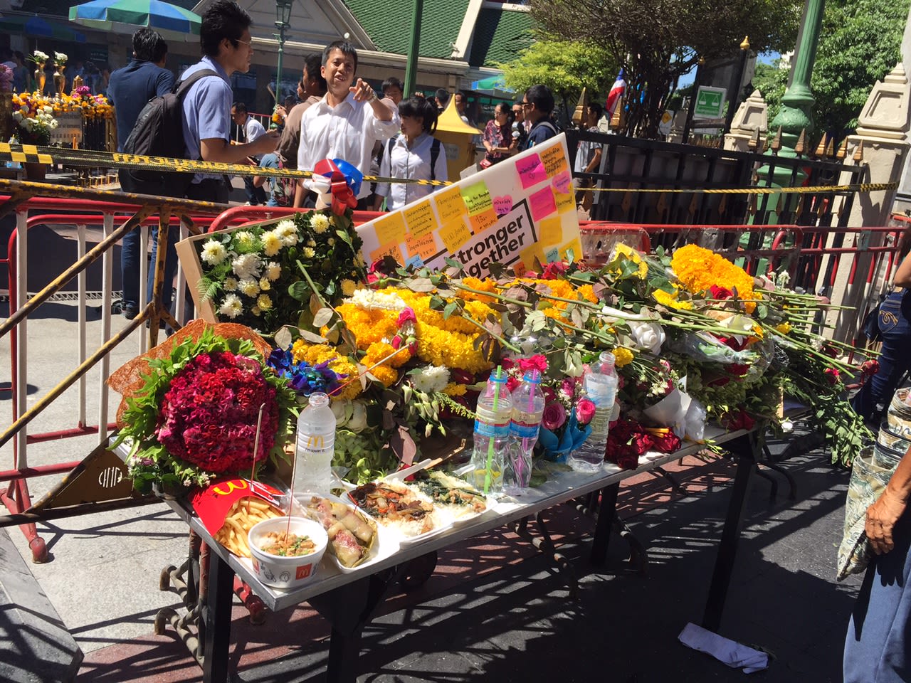 Messages and flowers for victims killed in the bomb blast are displayed outside the shrine. 