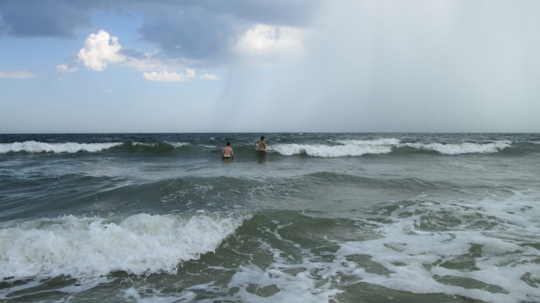 Hunter and his cousin Jacob frolicked in the waves in Oak Island unaware that danger lurked close by.