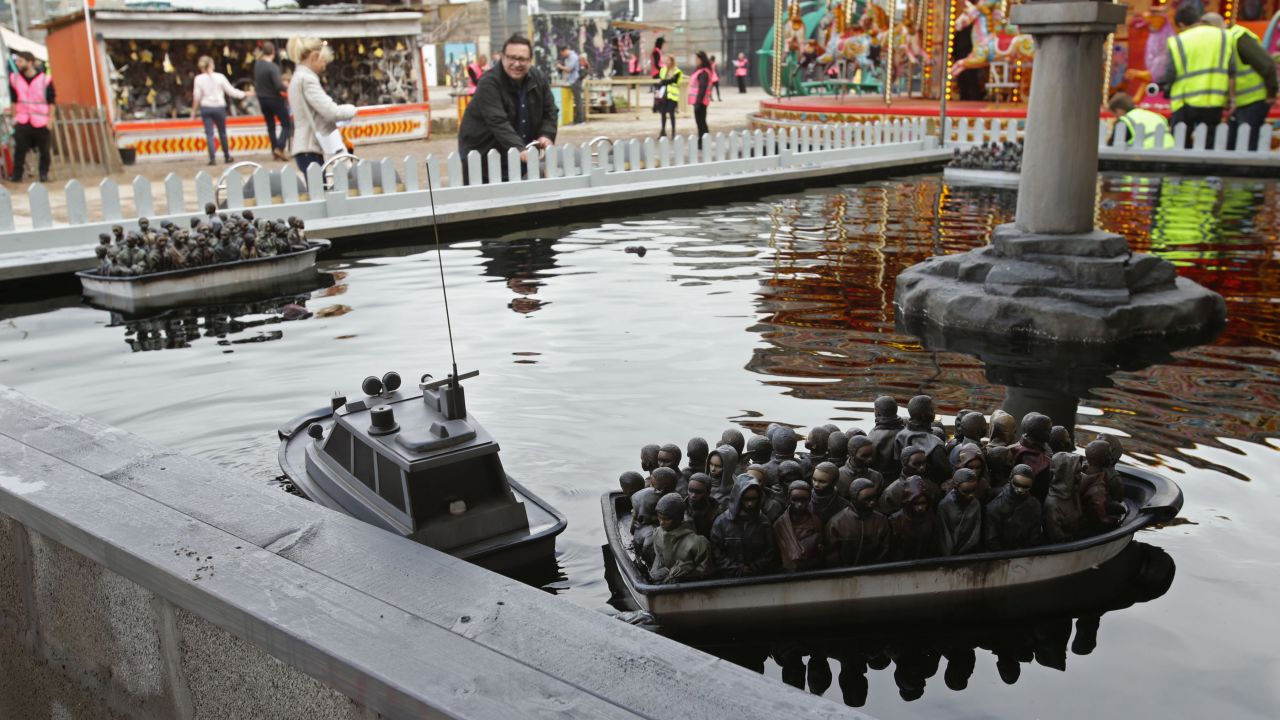 Not every piece was quite so whimsical. This more topical installation -- one of the many games at the amusement park -- makes a powerful statement about the ongoing migrant crisis. 