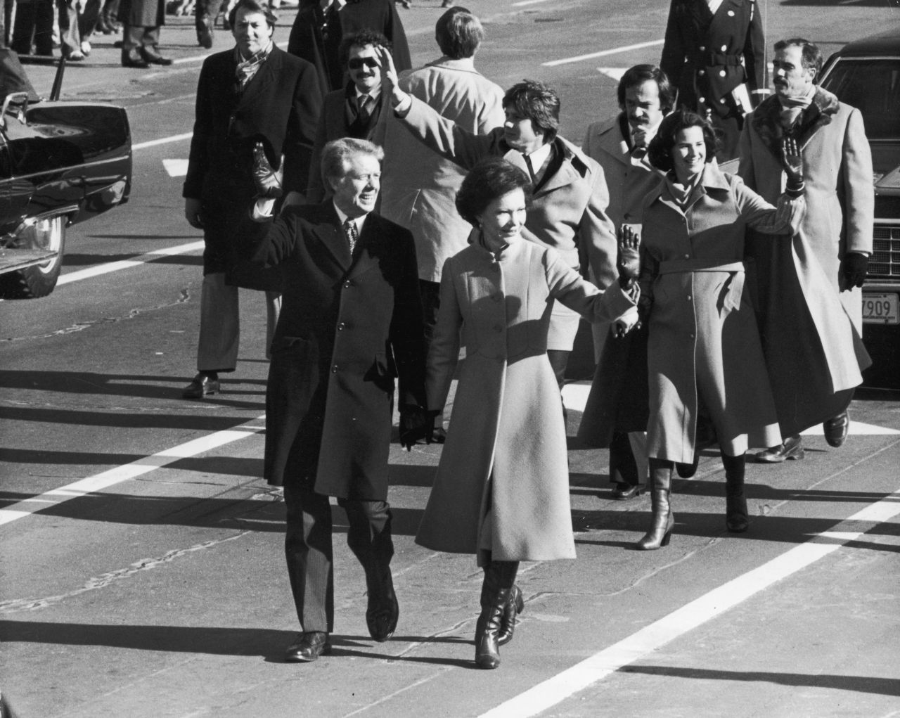 Carter holds his wife's hand during the inaugural parade.