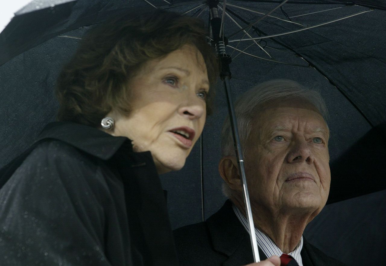 The Carters attend the grand opening ceremony of the William J. Clinton Presidential Center in Little Rock, Arkansas, in November 2004.