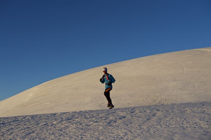 Under clear blue skies, Andreas Steindl begins his mountain challenge.