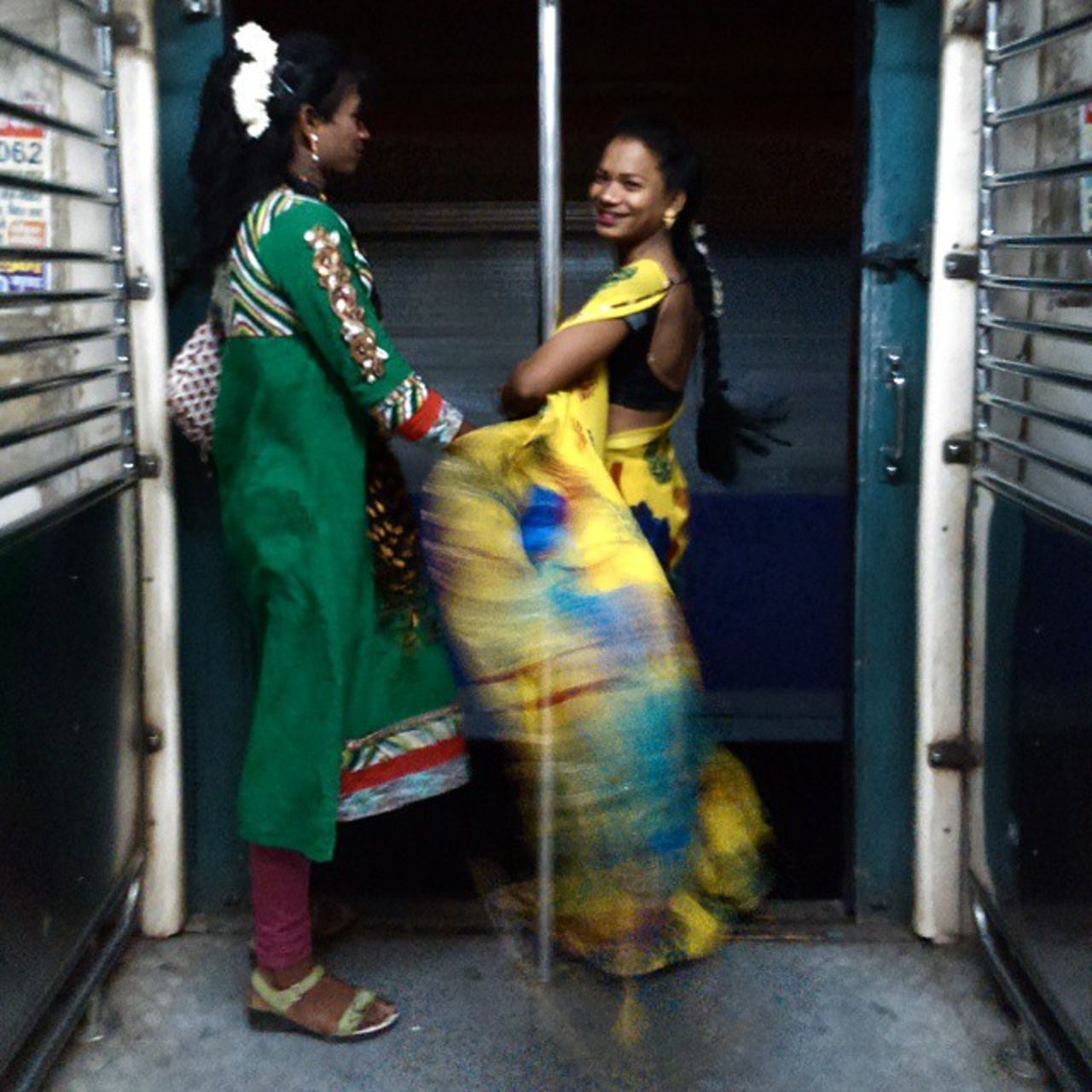 "<a href="https://instagram.com/p/veY3QNOQw1/" target="_blank" target="_blank">Barsha (left) and Sanjana</a> are eunuchs (men who have been castrated), dressed up for their everyday job. To me both looked so beautiful. Sanjana was smiling throughout. I asked Sanjana her age and she claimed to be 18 years old, which I don't think is true. Eunuchs in Mumbai usually travel in the train asking for money to run their daily life. They call it their job. Few of them work for late night events or as bar dancers."