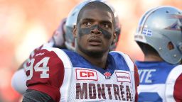 FILE - In this Aug. 7, 2014, file photo, Montreal Alouettes' Michael Sam and teammates warm up for a Canadian Football League game against the Ottawa Redblacks in Ottawa, Ontario. Sam is stepping away from pro football. Sam, the first openly gay player drafted by the NFL, has told the Alouettes that he is leaving the team. He tweeted Friday, Aug. 14, that "The last 12 months have been very difficult for me, to the point where I became concerned with my mental health. Because of this I am going to step away from the game at this time." (Justin Tang/The Canadian Press via AP, File)