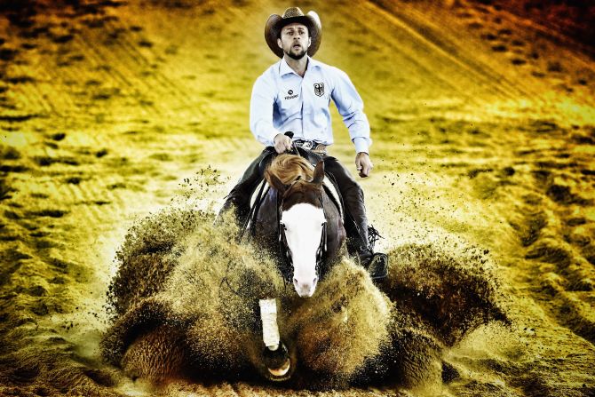 Grischa Ludwig of Germany rides his horse Shine my Gun during the Reining team competition. 