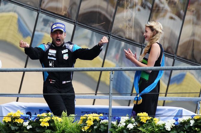 Dempsey celebrates on the podium after finishing second in the GTE Am class during the Le Mans 24 Hour race.