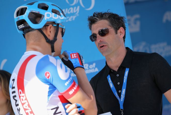As well as four wheels, Dempsey is a lover of two wheels. Here he is  pictured talking with Tom Danielson of the USA riding for Team Garmin-Sharp prior to the start of stage eight of the 2014 Amgen Tour of California in May 2014 in Thousand Oaks, California.