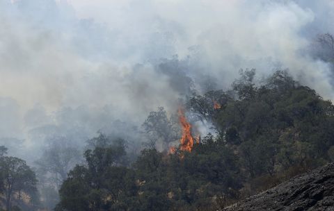 Fires burn on a hill in Livermore, California, on Thursday, August 20. California has been battling numerous wildfires as its historic drought reaches a fourth year.