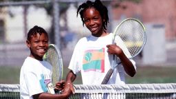 372178 11: FILE PHOTO: Sisters Serena, left, and Venus Williams shake hands after a game 1991 in Compton, CA. Serena and Venus Williams will be playing against each other for the first time July 6, 2000 in the tennis semifinals at Wimbledon. (Photo by Paul Harris/Online USA)