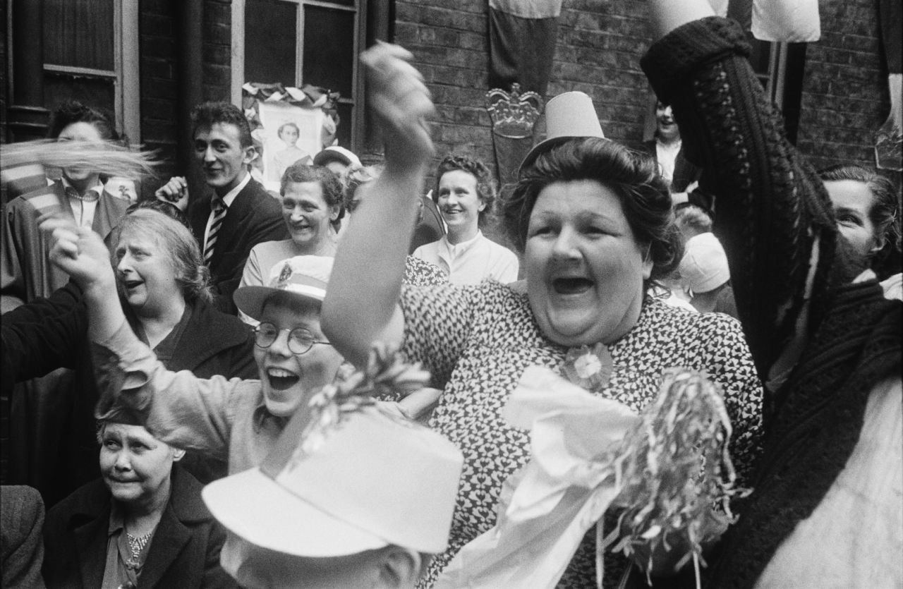 Londoners hold a street party to celebrate the Queen's coronation.