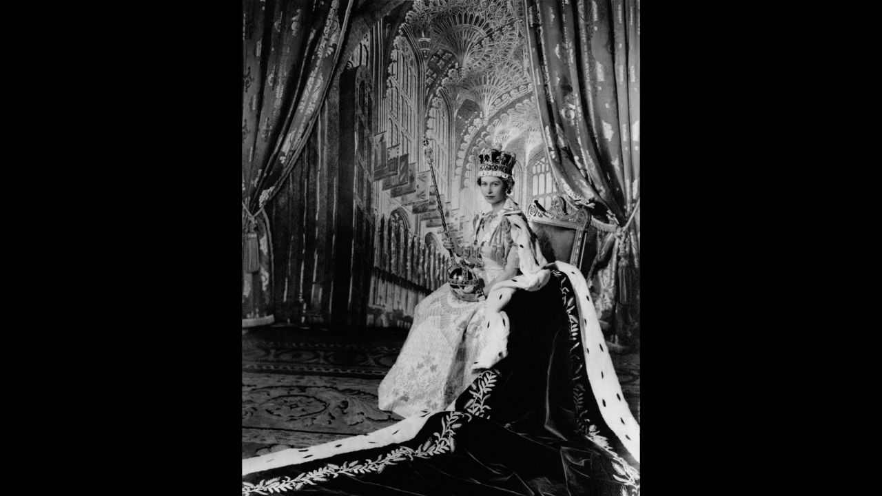 The Queen poses inside Buckingham Palace after her coronation.
